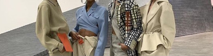 four models dressed in designer clothing