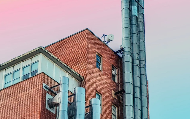 Corner view of an industrial building during sunset